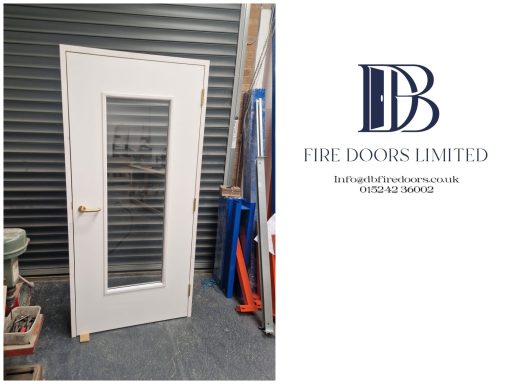 White fire door featuring a large vision panel and latch handle, manufactured by DB Fire Doors Limited.